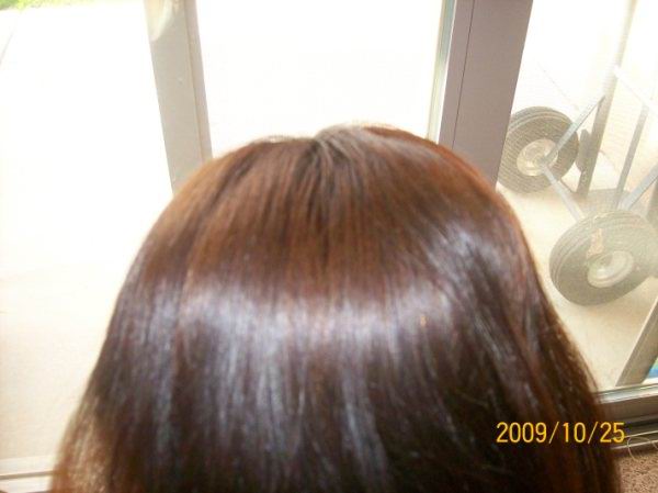 Picture of the top pf Lorrie's head, Renaissance Henna customer who coloured her sensitive scalp with natural henna hair dye . Her hair is glowing and looks soft and conditioned and a shiny brown colour with mild reddish tones. She was desperate to find a natural hair dye for sensitive scalp which she could trust.