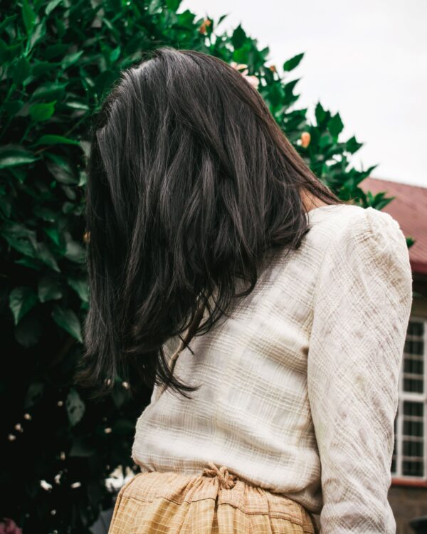 Long hair over face coloured with dark brown black hair dye