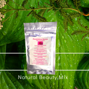 Natural Beauty Mix for Beautiful Skin, Sealed Foil Packet against a green leaf and single plant with flower background