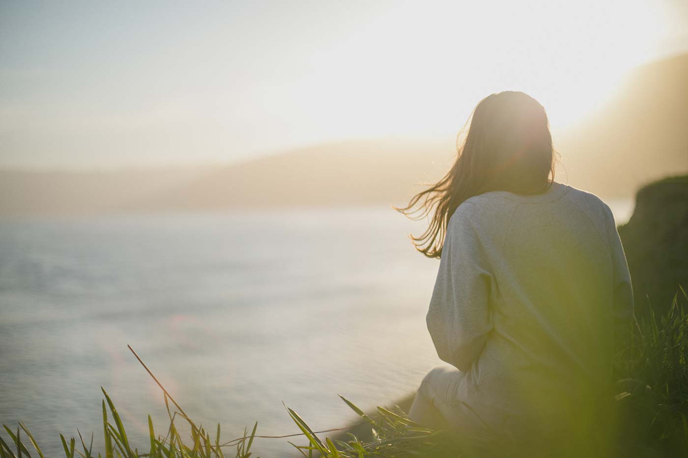 cancer and hair dyes, faded image of woman looking out to sea