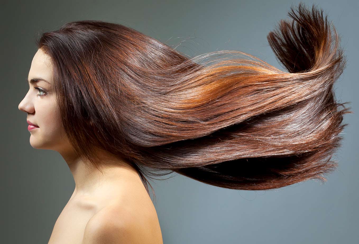 Natural Hair Dye. Beautiful Young Woman with Long Light Brown Hair Dyed with Henna Natural Hair Dye