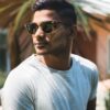 asian man in white T shirt and sun glasses with dark hair colour for men dark brown black