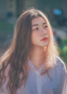 Organic shikakai healthy hair wash is for healthy hair and all hair types; woman with long, soft, brown hair wearing a white blouse