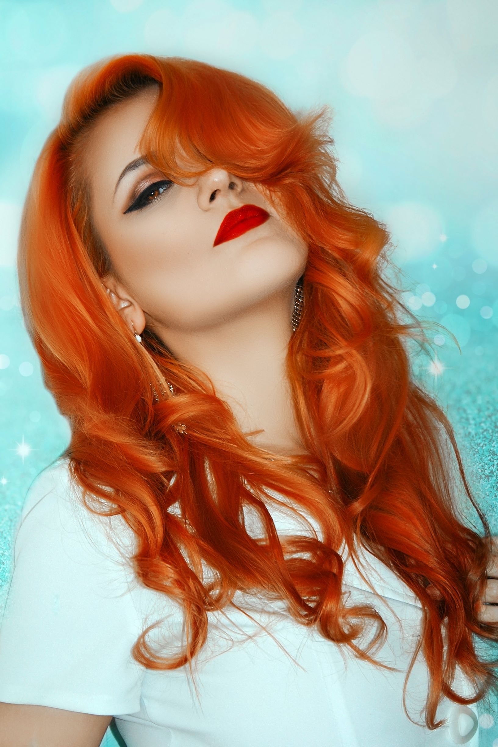 hair dyes after henna, photo of woman with long wavy auburn red dyed hair