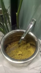 Renaissance Henna Powderin a small metal bowl with a teaspoon 