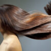 Natural brown permanent hair dye on beautiful woman with wavy hair